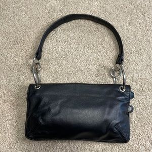 Wilson’s Leather Maxima black mini hand bag w silver hardware